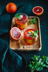 Refreshing cold summer cocktail with blood orange and mint.