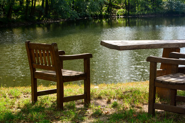 Fototapeta na wymiar A chair on a small lake