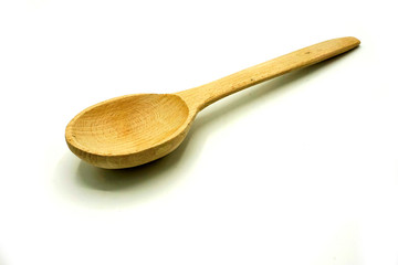 Wooden kitchen utensils on white background. Handcrafted wooden spoon.