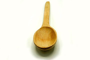 Wooden kitchen utensils on white background. Handcrafted wooden spoon.