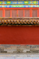 China red palace wall and Decoration colorful painting beam and wood pole from ancient china palace in Forbidden City, Beijing city, China