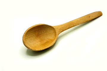 Wooden kitchen utensils on white background. Handcrafted wooden spoon.