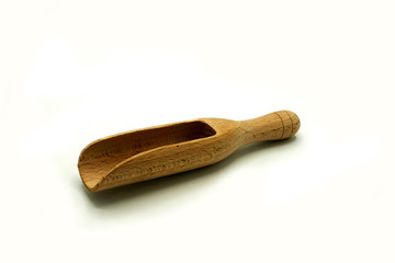 Wooden kitchen utensils on white background. handcrafted wooden shovel.