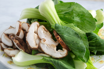 Close-up view of bok choy and mushrooms