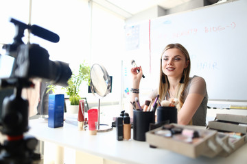 Beautiful Girl Recording Makeup Beauty Tips Vlog. Visagist Equipment and Cosmetic Product Review. Blond Woman make Video Blog on Camera. Trendy Fashion Vlogger Girl Social Lifestyle