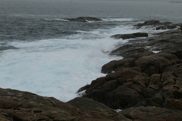CCliffs, waves and fog in Atlantic Ocean near A coruna.