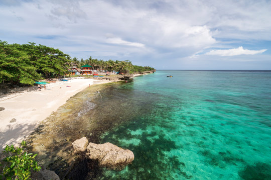 Turquoise blue water and beatiful beach on philippines island bohol anda. Diving swimming snorkeling travel vacation