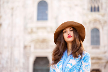 Portrait of a female model in front of the Duomo of Milan italy during the day