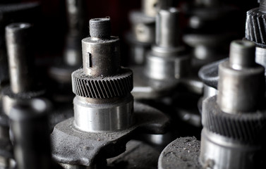 The gears of the machine in the car garage.