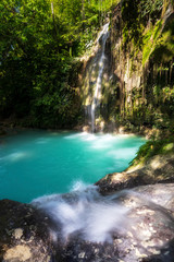 Fototapeta na wymiar quite waterfall on philippine island cebu near badian. No people 2020, amazing blue turquoise water