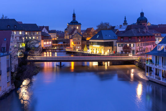 Aerial panoramic view of Old town hall or Altes Rathaus with bridges over the Regnitz river at night in Bamberg, Bavaria, Upper Franconia, Germany
