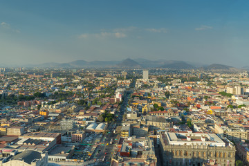 Fototapeta premium Panorama of Mexico city central part from skyscraper Latino americano. View with buildings. Travel photo, background, wallpaper.