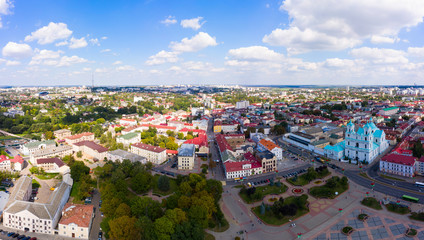 St. Francis Xavier Cathedral And Traffic In Mostowaja And Kirova Streets in the morning light. Grodno city in Belarus. Aerial view from a drone.