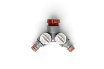 Y shaped garden hose connector for multiple hoses isolated on white background.
