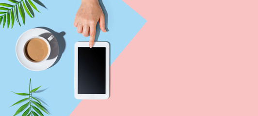 Person using a tablet computer from above