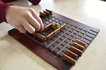 a board game and playing hand