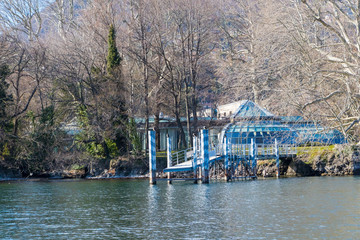 Tavernola, Italy - March 10, 2019: The small town of Tavernola with small boat dock at lake Como in...