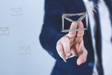 man touching in screen letter