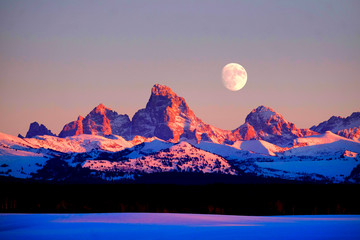 Sunset Light Alpen Glow on Tetons Teton Mountains wtih Moon Rising