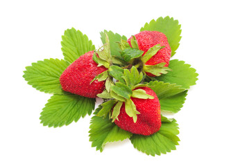 Ripe strawberry with leaves.