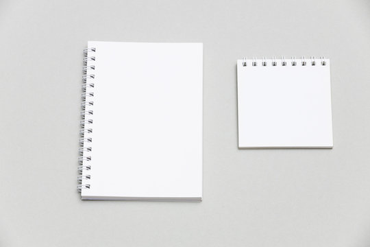 Blank Notebook Or Notepad On Grey Desk Background