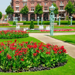 Cityscape with bright flower beds and lawns. Friedrichsplatz square in Mannheim - Germany .