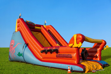 Inflatable slide - a large toy on the lawn