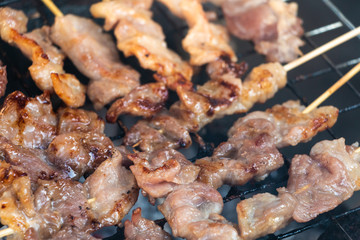 grilling pork in local market