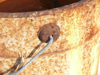 fragment of a rusty bucket handle
