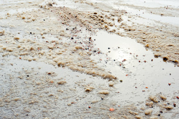 Paved road covered with melting snow