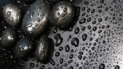 Black stones with drops