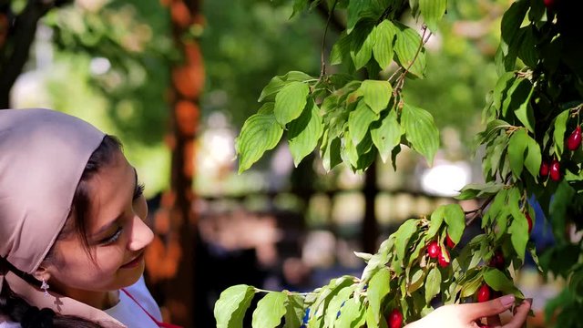 A beautiful young girl picked dogwood and smiling