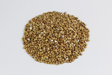 Green buckwheat on a white background close-up.