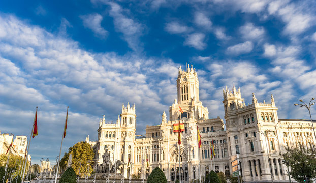 Cybele Palace (Palacio de Cibeles) and Cibeles fountain in Madrid at golden hour