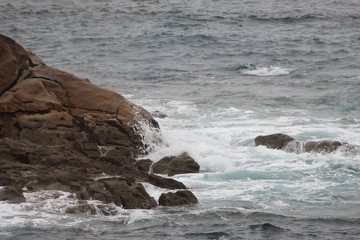 CCliffs, waves and fog in Atlantic Ocean near A coruna.