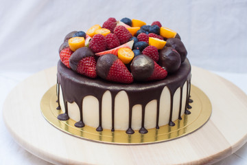 Vanilla cheesecake with dark chocolate and fresh berries, strawberries, raspberries, blueberries...