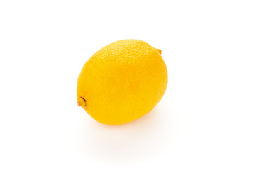 Ripe lemon close up  on white background