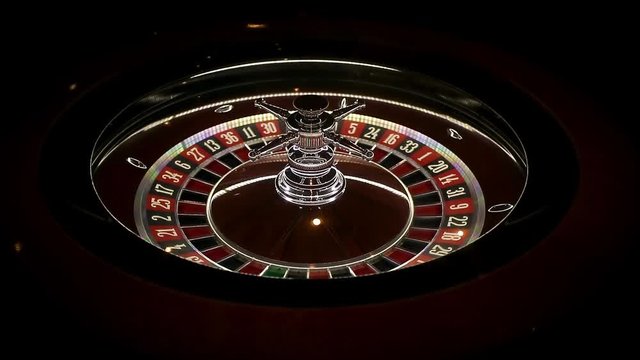 spinning bright roulette on game table from elite casino