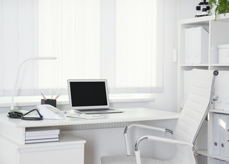 Doctor's workplace near window in medical office