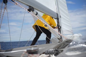 White bearded sailing senior, experienced skipper on a sailboat