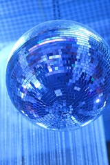 disco ball on blue background of lights