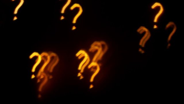Question sign on black background. Glowing symbol 