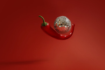 Disco ball and red pepper, hot party concept
