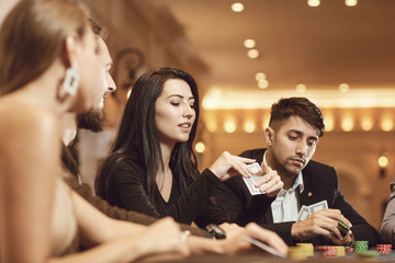 Friends gamble poker roulette in a casino