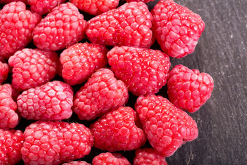 fresh raspberries as background, top view