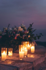 Candles and flowers as decorations in the evening.