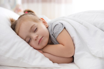 Obraz na płótnie Canvas Cute little girl sleeping at home. Bedtime schedule