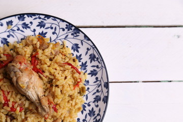 plate of rice with chicken and peppers