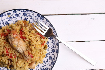 plate of rice with chicken and peppers