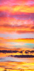 Fototapeta na wymiar Panorama of colorful x clouds in the sunset sky
